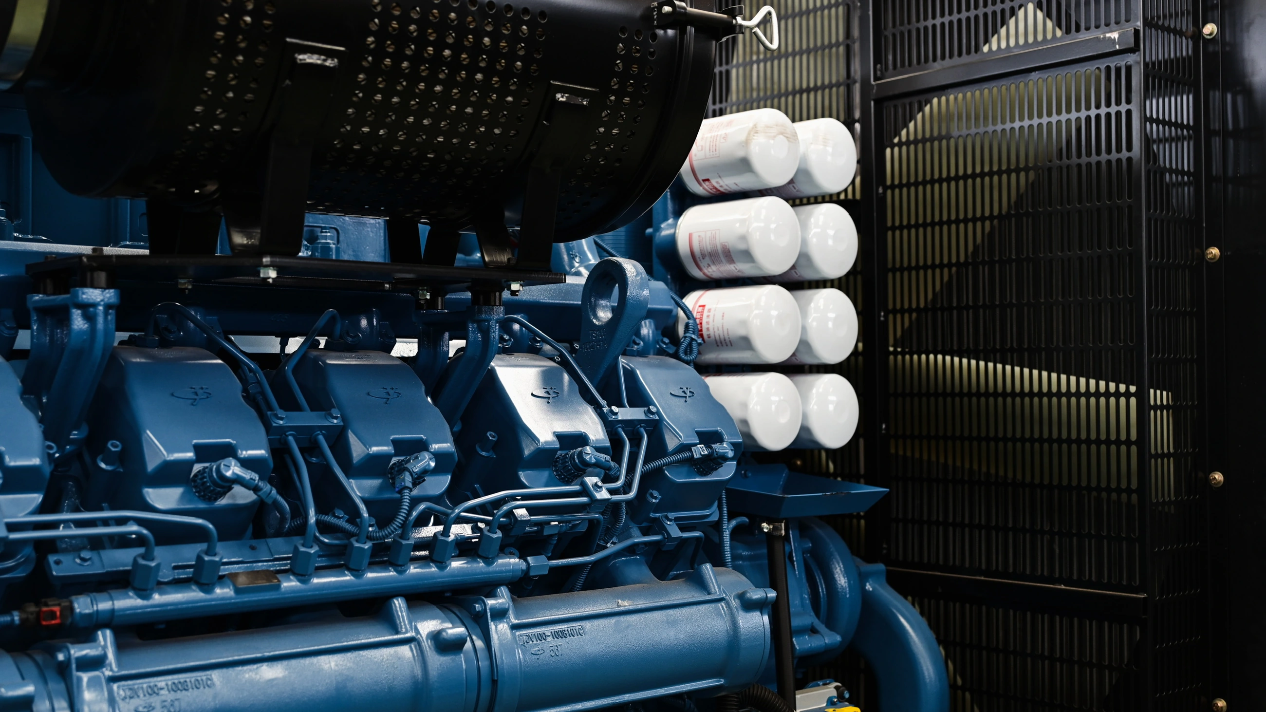 Close-up of blue diesel engine components and filters